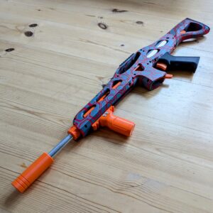 Jeg laver 3D printede nerf blasters, som bruges til vores voksennerf events. Her kan vi blandt andet spille på biblioteker og skoler. Blasteren er en ontos der er printet på min Prusa XL, med alle dele købt på AliExpress og kan laves for et par hundrede kroner
